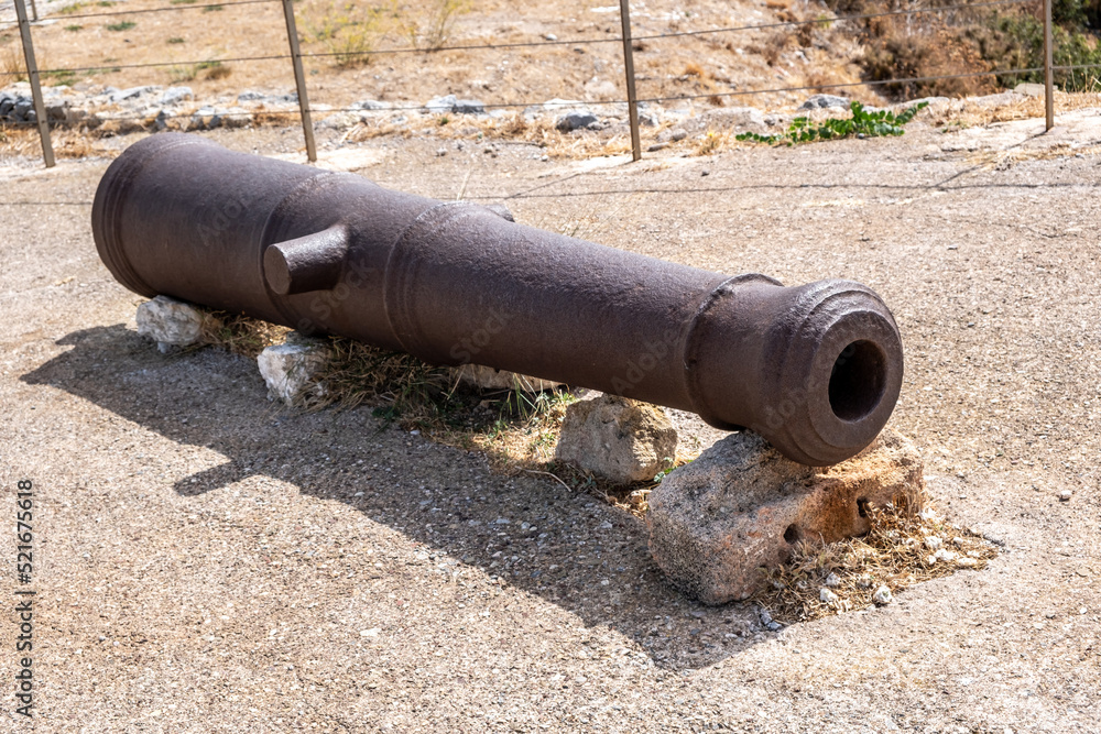 Cannon antique resting on rock at Venetian Castle or Fortezza. Kythira Ionian islands, Greece.
