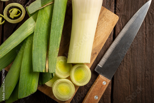 Sliced ​​leek on wooden table. photo