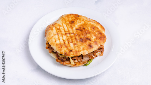 Chicken tombik doner kebab in plate tray top view isolated