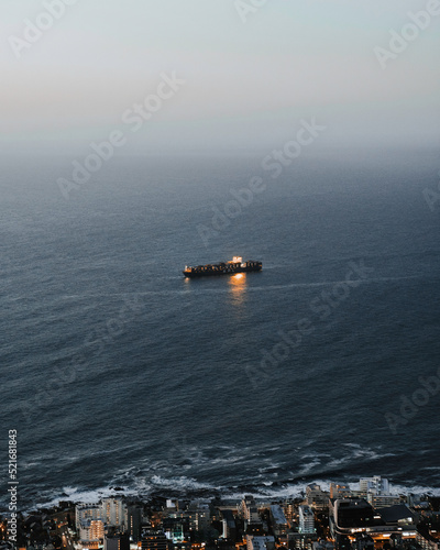 Cargo ship in the evening on he sea photo