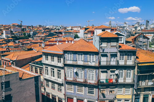 Density of buildings in Porto city with very orange roofs on summer day 