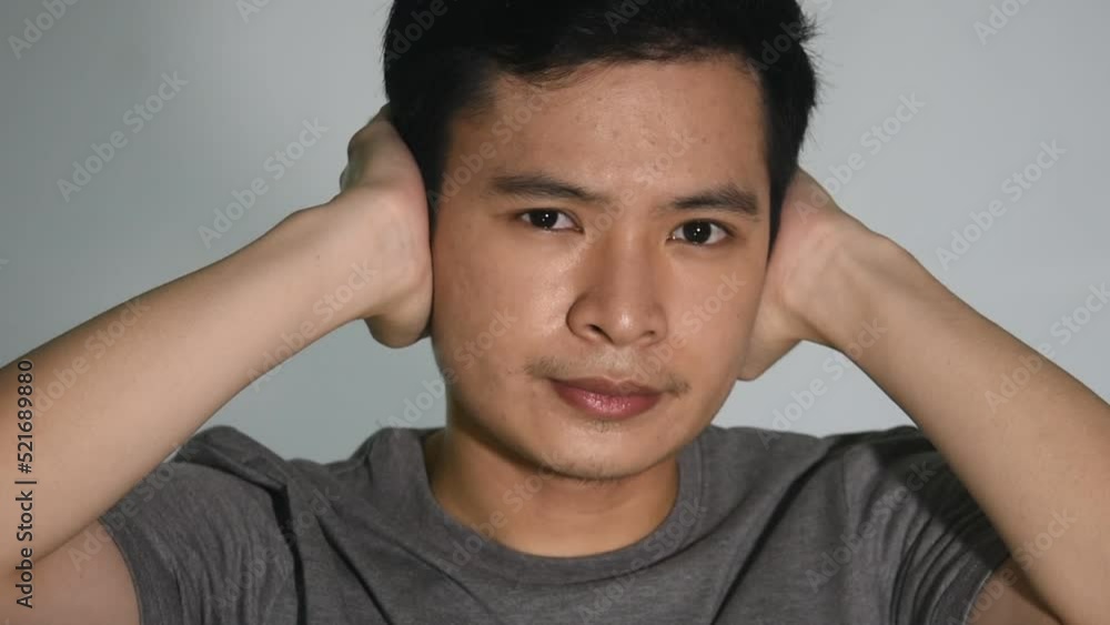Asian Man Covering Ears Eyes And Mouth Asian Man Covering Ears Eyes And Mouth
