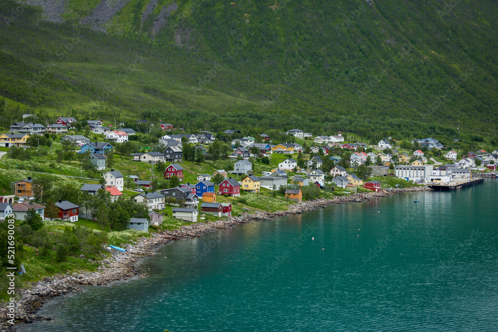 A view of the village by a fjord in Norway from the road leading to it
