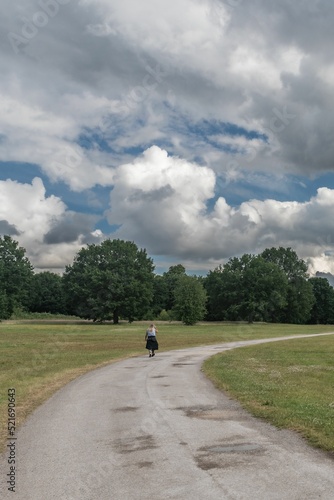 Woman Walking In Staffordshire Lakeside Woodland Landsca photo