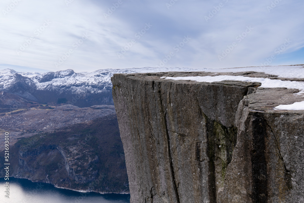 Preikestolen or Prekestolen, a 604 m high cliff in Norway, located by the Lysefjord Preikestolen or Prekestolen, a 604 m high cliff in Norway, located by the Lysefjord