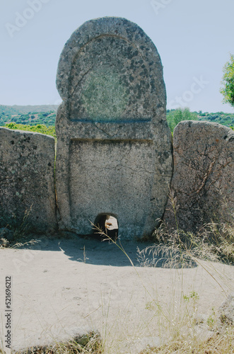 Arched stele of the Giants' grave of S'Ena'e Thomes ( nuragic-era archaeological site), Sardinia, Italy photo