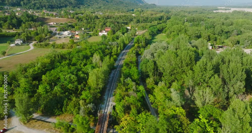 Aerial view of Train Bridge spanning over small River in Italy Aerial view of Train Bridge spanning over small River in Italy