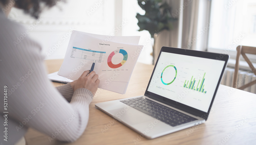 Workplace in the office is working with documents, a woman makes a report Workplace in the office is working with documents, a woman makes a report