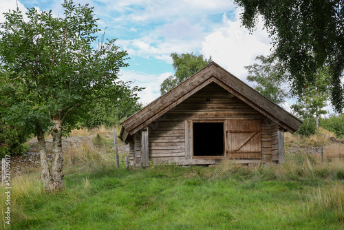 Small pasture storage cottage in green field. © Andreas Bergerstedt