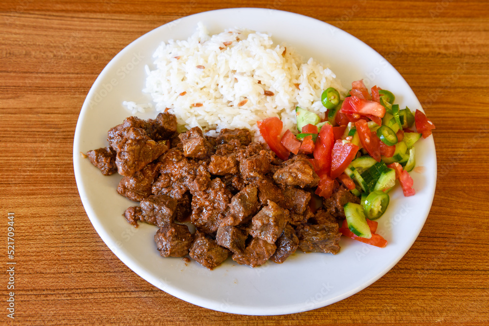 Beef steak grill with rice pilaf, fried potatoes, grilled pepper and tomatoes.Mix Platter with Beef rips, Cutlets, Potatoes and Sauces. Beef steak grill with rice pilaf, fried potatoes, grilled pepper and tomatoes.Mix Platter with Beef rips, Cutlets, Potatoes and Sauces.