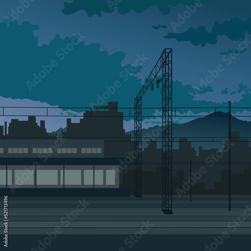 Night beautiful view of a railway station on the backdrop of city and mountains before sunrise. Urban picture as poster, cover, wallpaper or background.