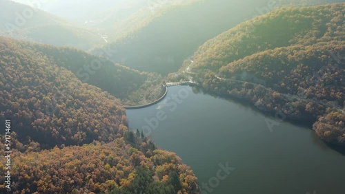 Wallpaper Mural Aerial view of concrete arch dam with a reservoir lake and beautiful autumn forest around Torontodigital.ca