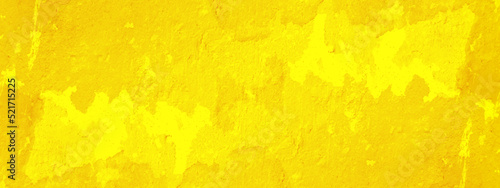 Abstract yellow grunge texture with scratches and peeling paint. Grainy messy warm grunge splashed yellow background with seamless vintage grunge texture, yellow paper texture with scratched paints.