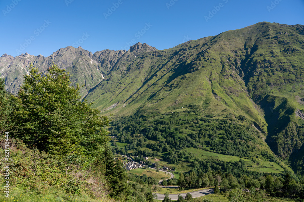 forested canyon and gorge in a mountain range, clear blue summer sky