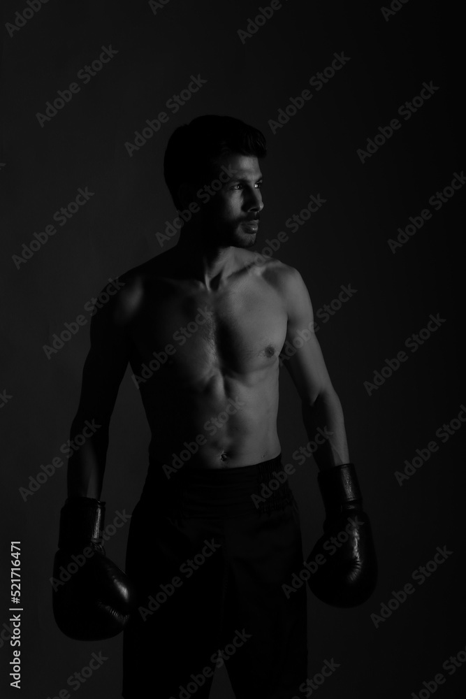 Naklejka premium Low key portrait of a boxer