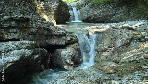 Beautiful waterfall between stones of a rivulet in the mountains