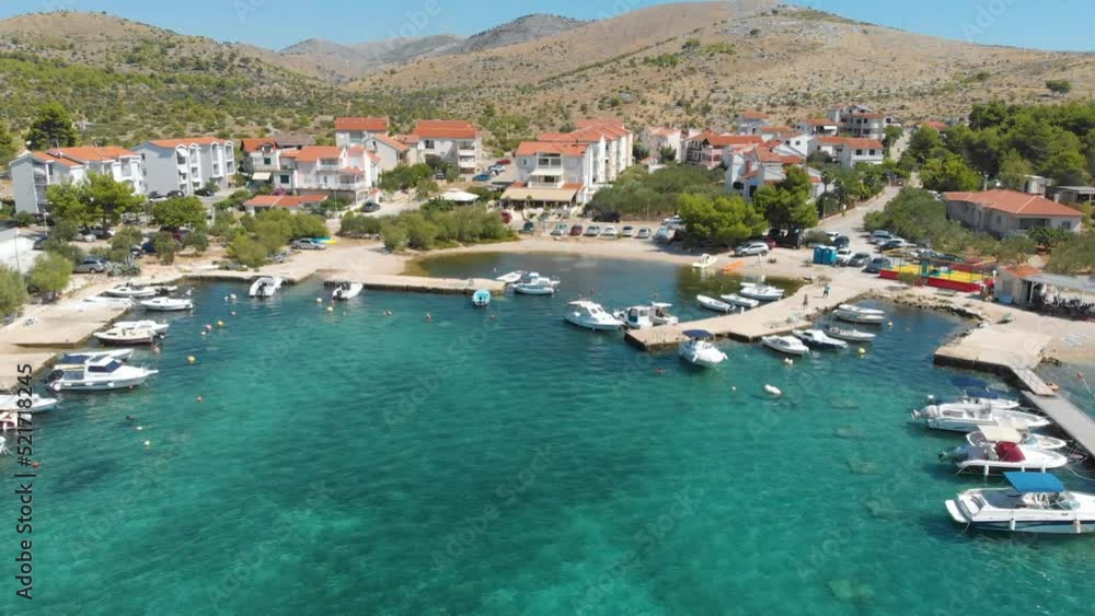 Croatia. Coast of the Adriatic Sea. Small town by the sea. Summer. Tourist season. Popular place to relaxation. Drone. Aerial view. The camera moves forward and down Croatia. Coast of the Adriatic Sea. Small town by the sea. Summer. Tourist season. Popular place to relaxation. Drone. Aerial view. The camera moves forward and down