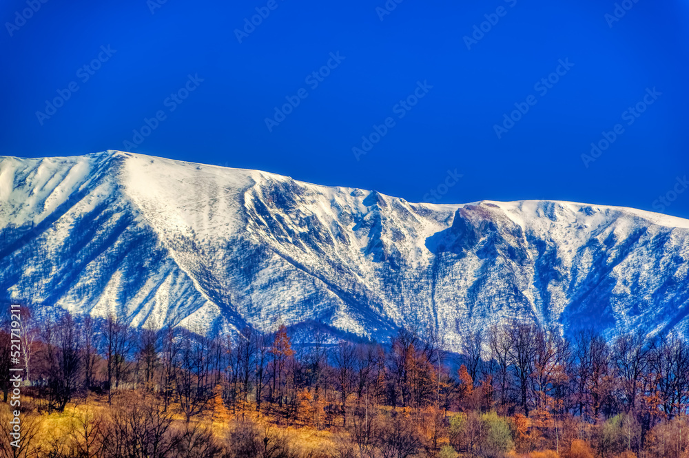 Mountain landscape in Bosnia and Herzegovina covered with snow during sunny winter day.