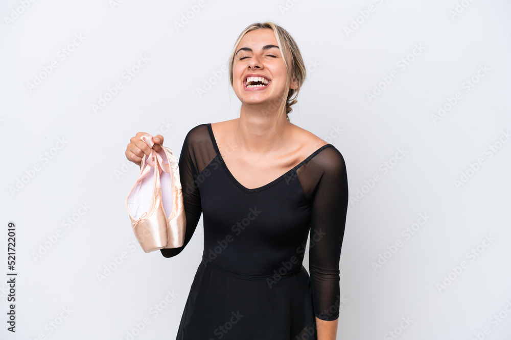 Young caucasian woman practicing ballet isolated on white background laughing Young caucasian woman practicing ballet isolated on white background laughing
