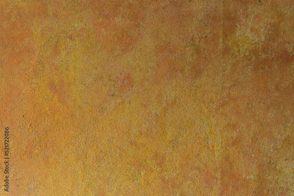 The yellow-orange texture of the aged concrete wall of an old house. Decorative textured plaster, inside surface finish at home. Abstract background with construction concept. The yellow-orange texture of the aged concrete wall of an old house. Decorative textured plaster, inside surface finish at home. Abstract background with construction concept.