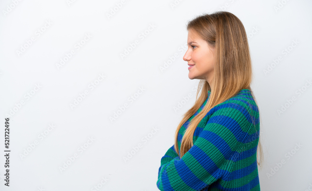 Young caucasian woman isolated on white background in lateral position Young caucasian woman isolated on white background in lateral position
