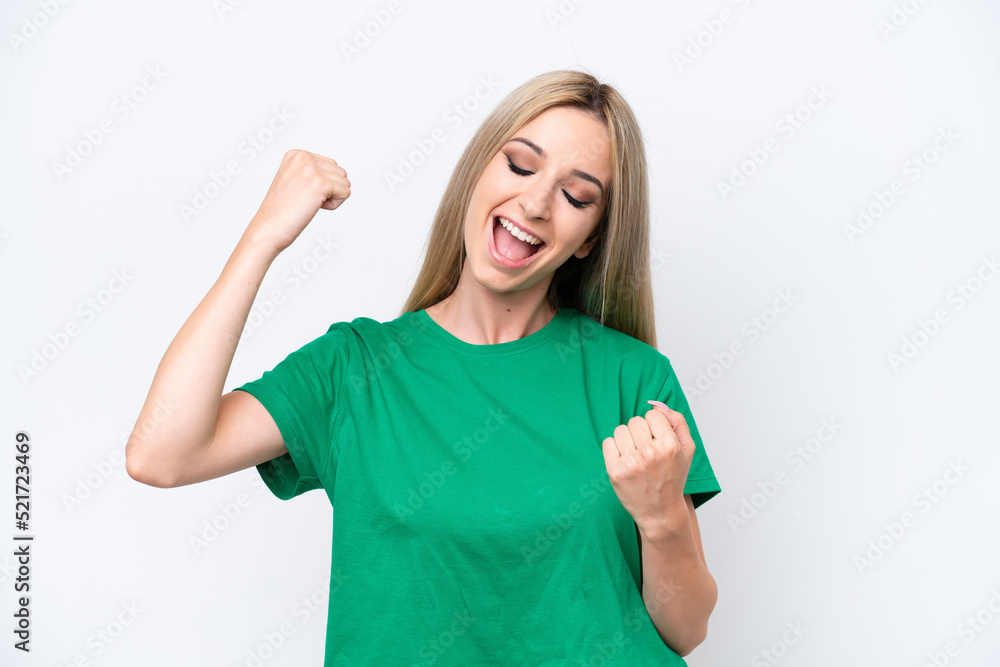 Fototapeta premium Pretty blonde woman isolated on white background celebrating a victory