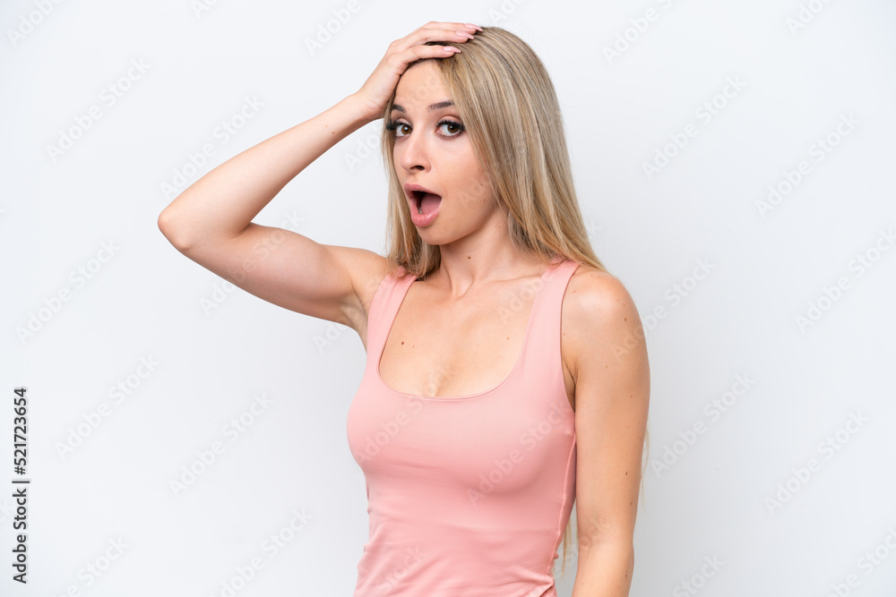 Pretty blonde woman isolated on white background doing surprise gesture while looking to the side Pretty blonde woman isolated on white background doing surprise gesture while looking to the side