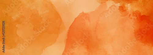 Orange watercolor background texture, blotches of watercolor paint, textured autumn or fall paper, light orange watercolor wash with abstract blob design