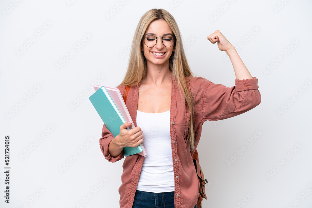 Pretty student blonde woman isolated on white background doing strong gesture Pretty student blonde woman isolated on white background doing strong gesture