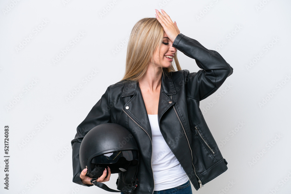 Pretty blonde woman with a motorcycle helmet isolated on white background has realized something and intending the solution Pretty blonde woman with a motorcycle helmet isolated on white background has realized something and intending the solution
