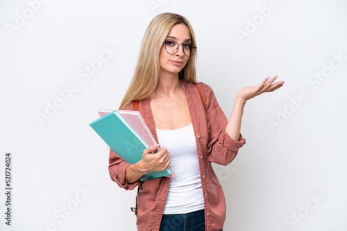 Pretty student blonde woman isolated on white background extending hands to the side for inviting to come