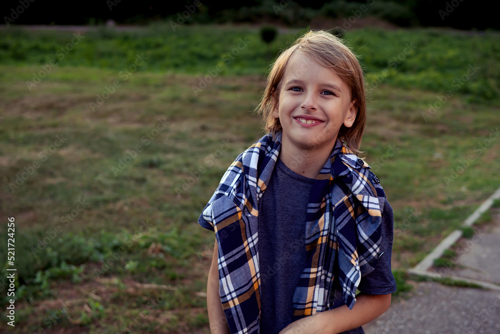 Teenger blonde boy outdoor park lifestyle portrait