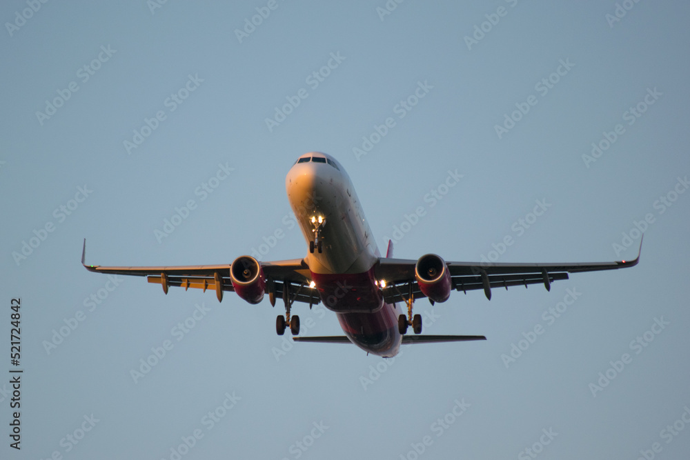 Plane after take off. A passenger aircraft in the sky at sunset. Plane after take off. A passenger aircraft in the sky at sunset.