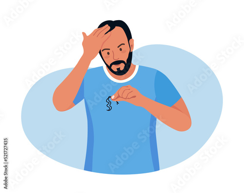 Alopecia and hair problems, baldness. Young man looks sadly at strands of hair in hand. Character feel upset because of hair loss. Lack of vitamins and important amino acids. Person in stress