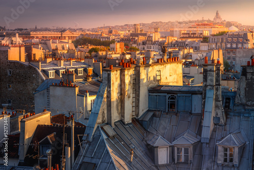 Parisian roofs of Montparnasse and Montmartre at sunset Paris, France © Aide
