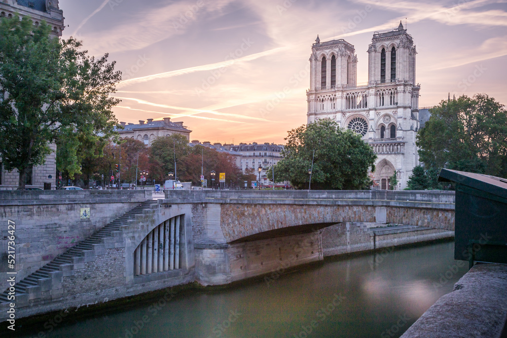 Notre Dame Cathedral of Paris and Seine river at dramatic dawn, France