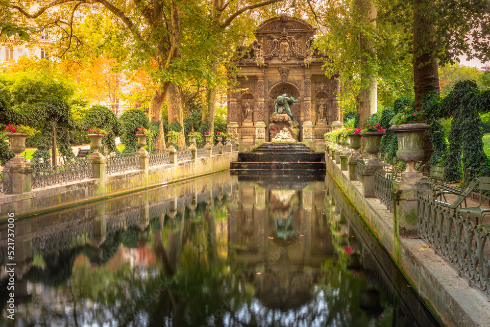 Peaceful Medici fountain pond in Luxembourg gardens, Paris, France