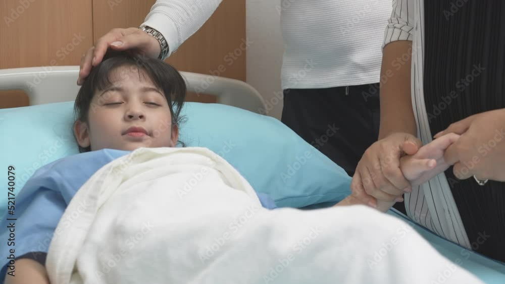 Family with father and mother stroking head for care to daughter while