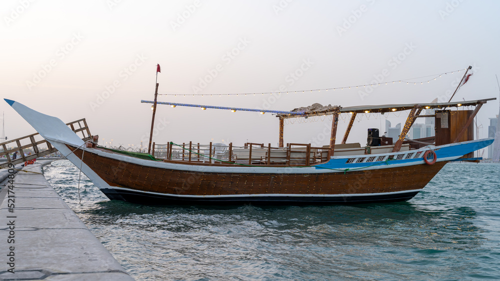 Qatar's Traditional fishing boat Dhow waiting for a boat ride in Qatar corniche. boat ride is one of the special tourist activity.