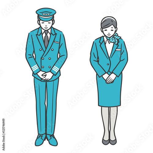 お辞儀をする機長と客室乗務員