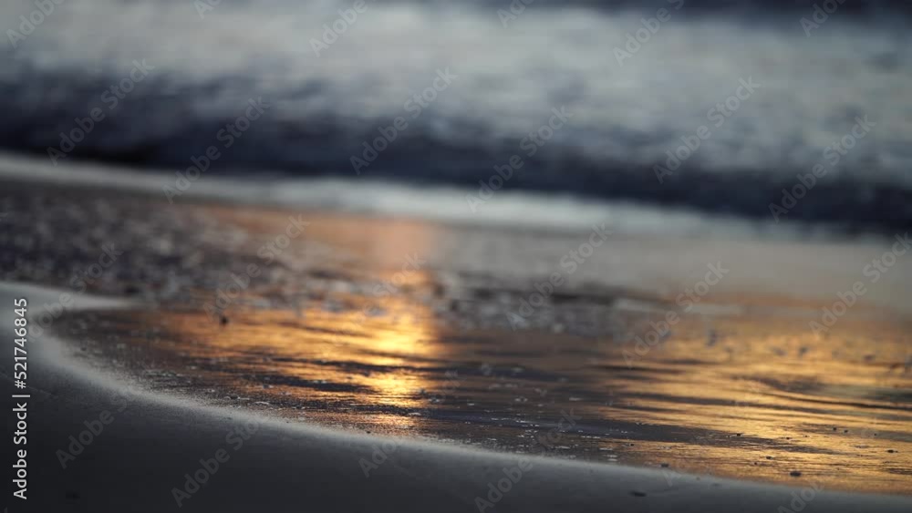 sunrise reflecting on the beach with golden light as waves roll in and water moves on the sand, calming waves
sunrise reflecting on the beach with golden light as waves roll in and water moves on the sand, calming waves