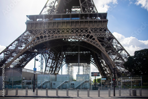 The base of the Eiffel Tower seen from its base next to the Seine River in Paris, this place is visited by many travelers and tourists and it is the mythical scenery and background of France. photo