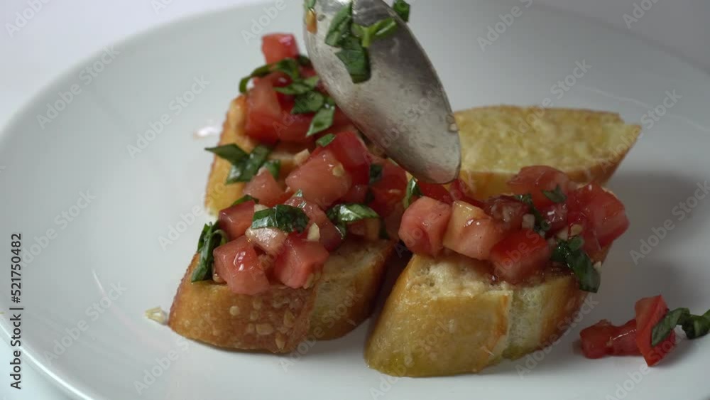 Classic tomato sandwich or Italian bruschetta with parsley tomato, garlic on toasted bread Classic tomato sandwich or Italian bruschetta with parsley tomato, garlic on toasted bread