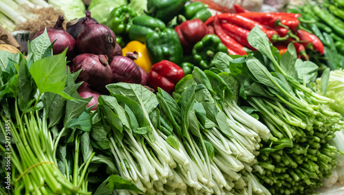 various of fresh green vegetables at the market 