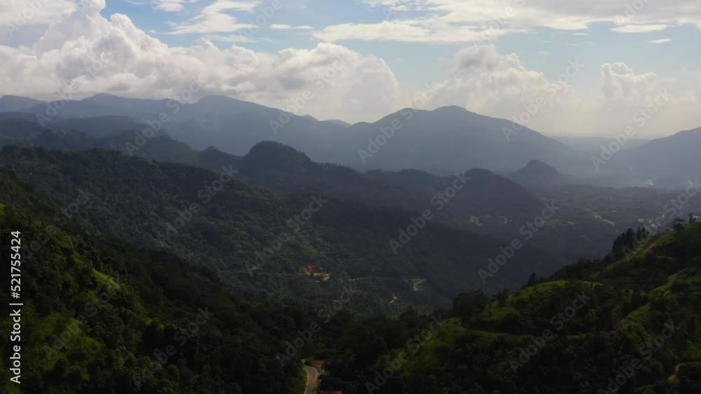 Mountain landscape: Mountain slopes covered with rainforest and jungle View from above. Sri Lanka. Mountain landscape: Mountain slopes covered with rainforest and jungle View from above. Sri Lanka.