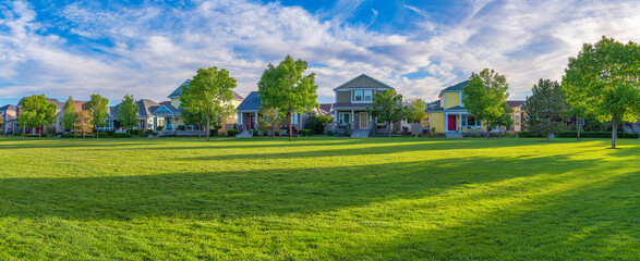 Residential area at Daybreak, Utah with large green fied at the front
