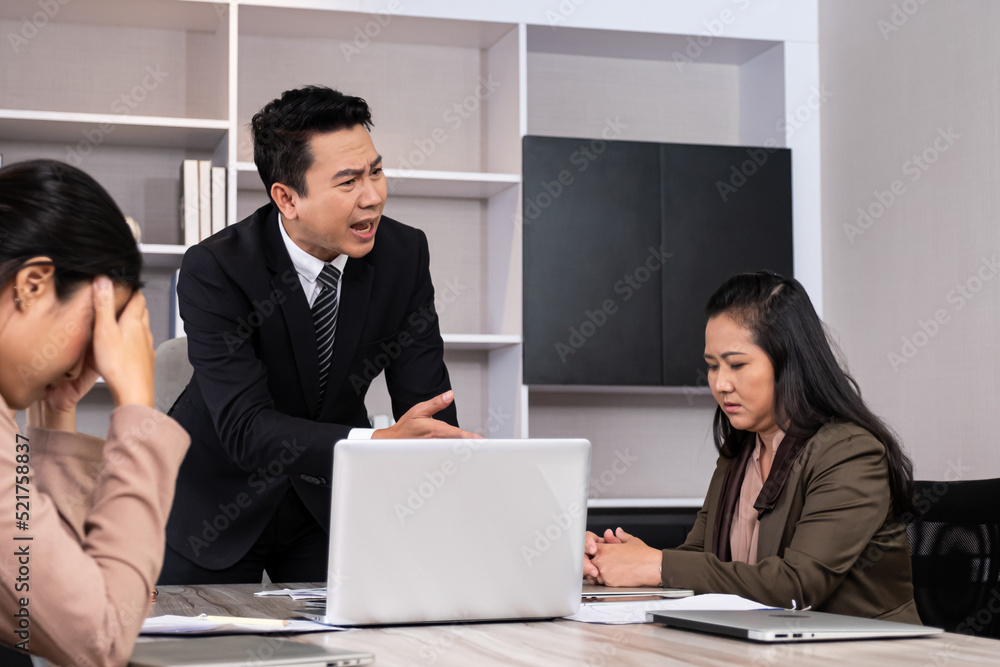 Asian men manager scold and angry with their employee inside of office meeting room with upset and stress worker. Business failure. Problem in working office, Negative emotion workplace. Asian men manager scold and angry with their employee inside of office meeting room with upset and stress worker. Business failure. Problem in working office, Negative emotion workplace.