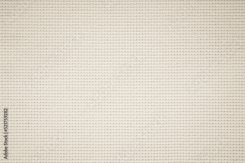 Fabric canvas woven texture background in pattern in light beige cream brown color.