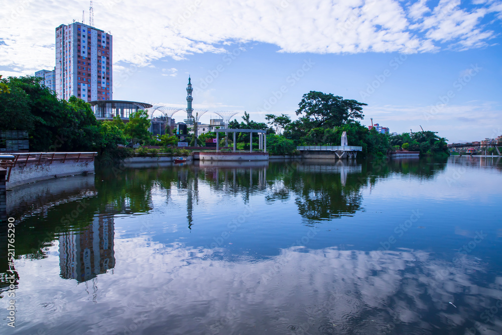 White cloudy blue sky Scenic View reflection Against Lake water White cloudy blue sky Scenic View reflection Against Lake water