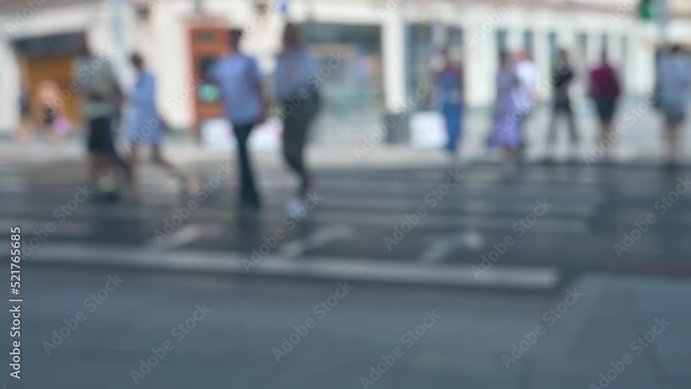Walking crowd of people crossing the road. 4k video with blur effect. Out of focus Walking crowd of people crossing the road. 4k video with blur effect. Out of focus